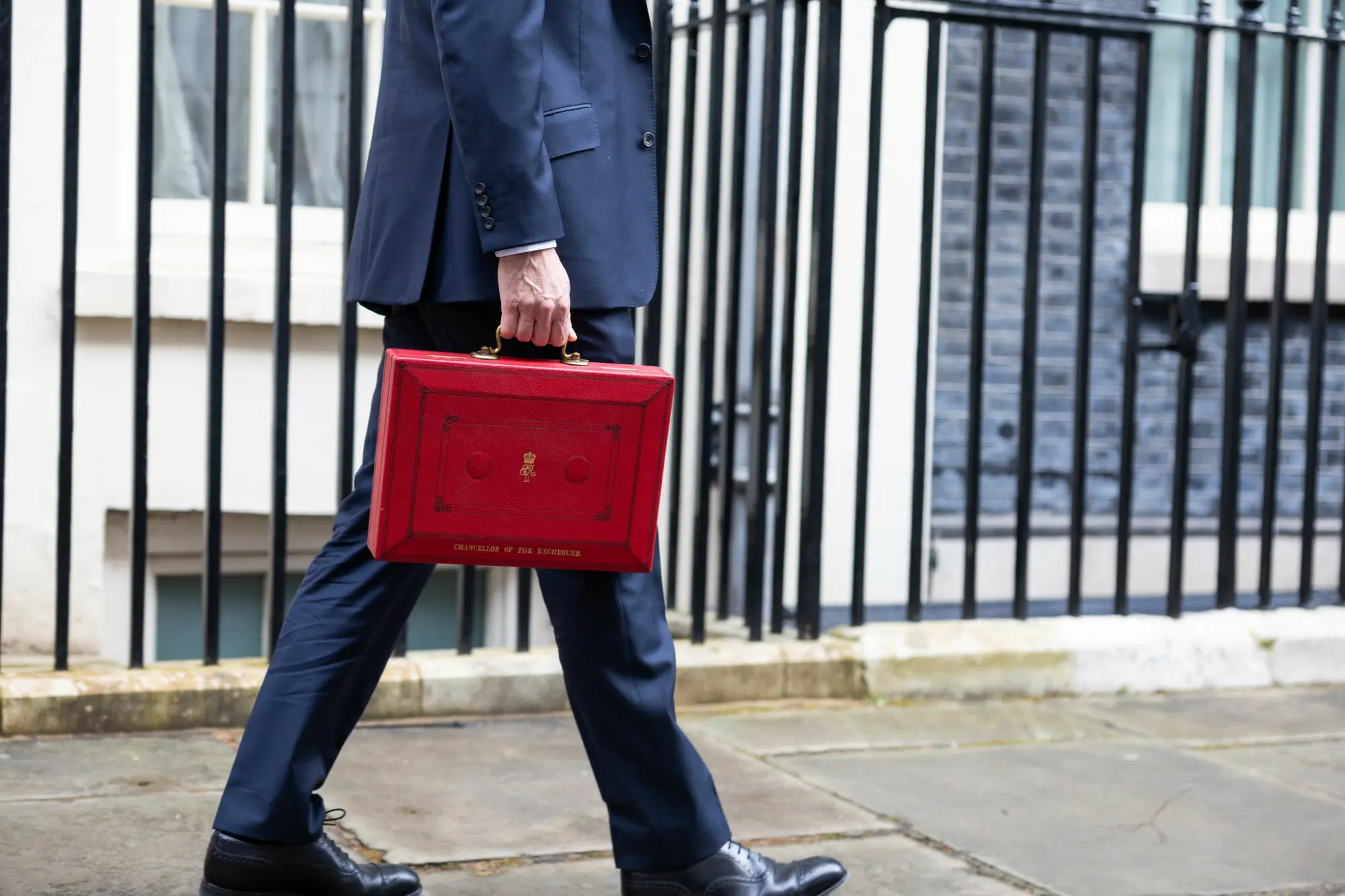 The Chancellor Jeremy Hunt walks outside Downing Street with the Budget box. Photo by Zara Farrar / HM Treasury