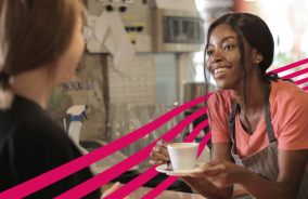 Coffee being served by barista in cafe