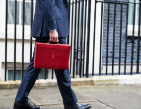 The Chancellor Jeremy Hunt walks outside Downing Street with the Budget box. Photo by Zara Farrar / HM Treasury