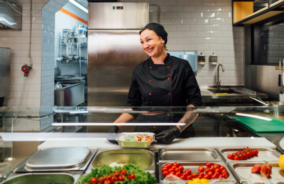 Catering employee preparing food