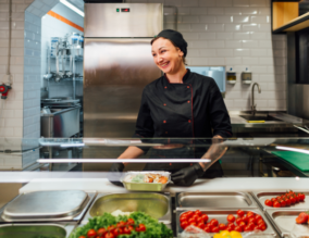 Catering employee preparing food