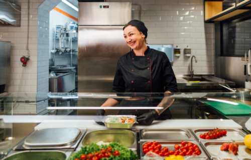 Catering employee preparing food