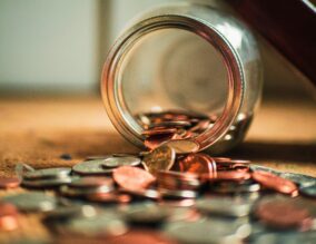 Money and coins spilt onto a table