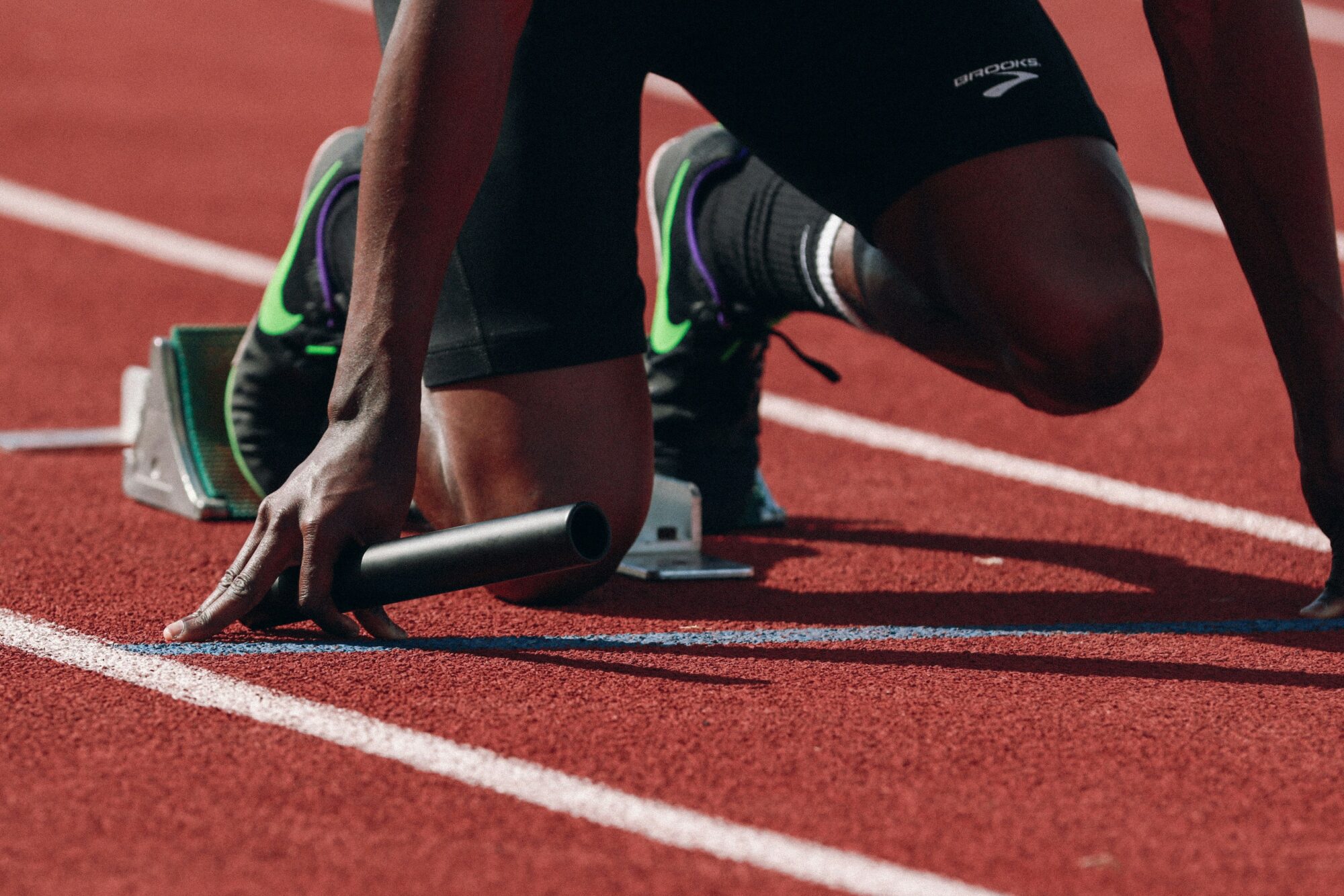 Runner preparing to run on race track