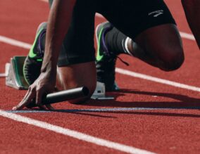 Runner preparing to run on race track