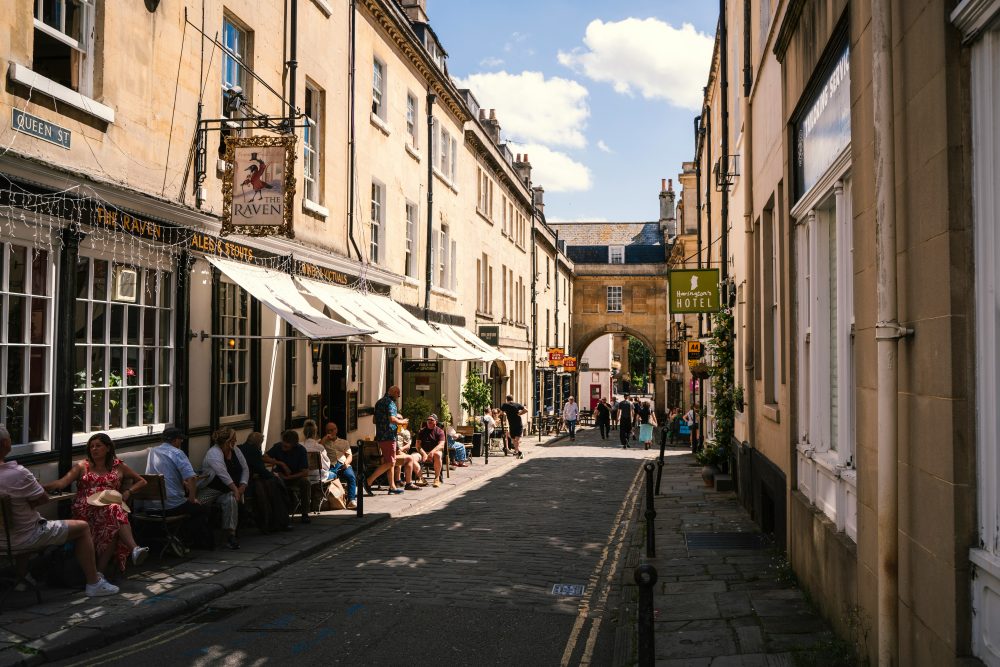 Customers sitting outside pubs and cafes