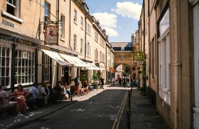 Customers sitting outside pubs and cafes