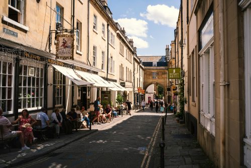 Customers sitting outside pubs and cafes
