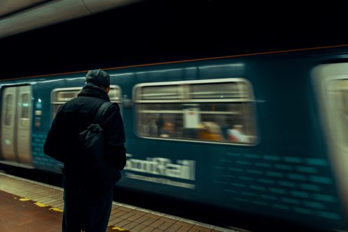 Man waiting for a train at Glasgow Central